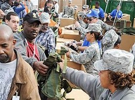 SOldiers passing out clothing and food at a Stand Down